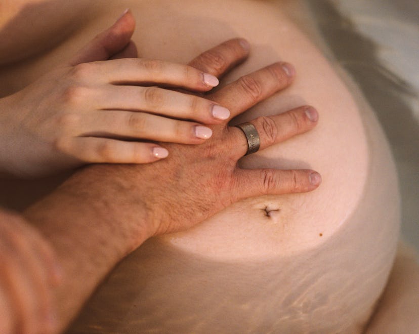 hands on a pregnant belly