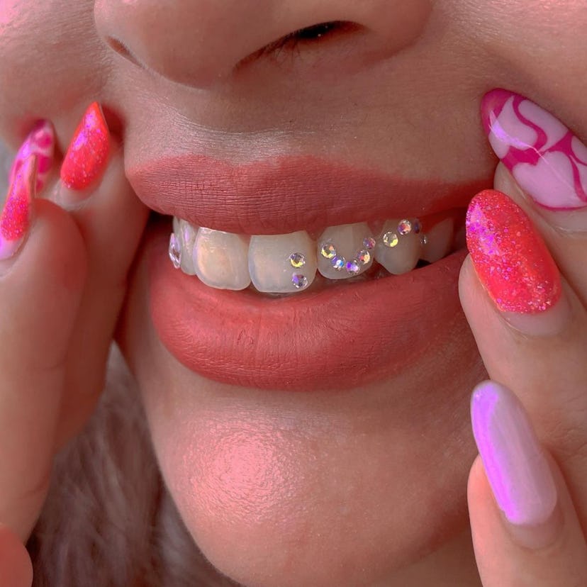 woman wearing tooth gems