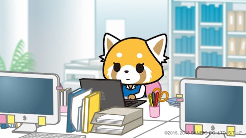 A still image from the Netflix anime Aggretsuko, showing main character Retsuko sitting behind a lap...