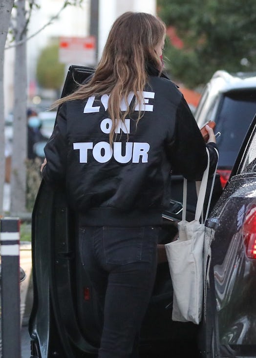 Olivia Wilde wears a Harry Styles 'Love On Tour' jacket.