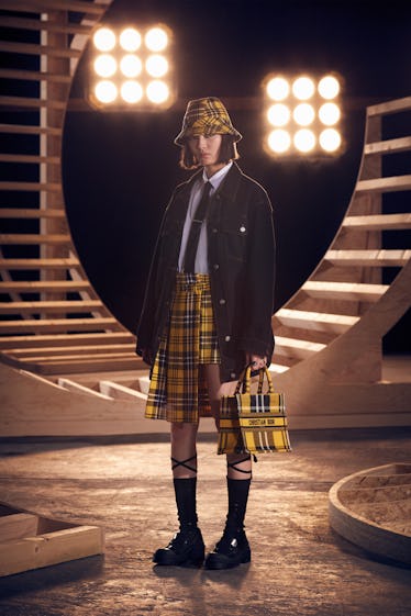 Model in yellow tartan look from Dior pre-fall 2022.