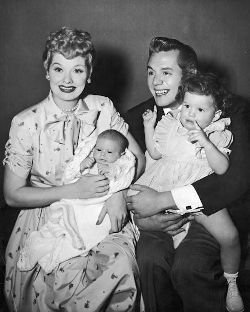 Lucille Ball and Desi Arnaz hold their two children, Desi Jr (left) and Lucie. 