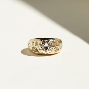A chunky yellow gold and diamond engagement ring by Grace Lee.