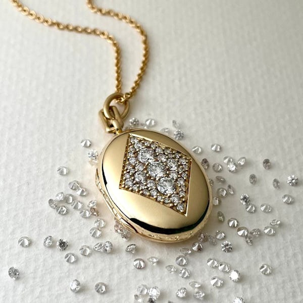 A diamond and yellow gold locket by Monica Rich Kosann.