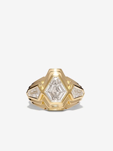 A staircase diamond ring with a shield cut center and side stones by Azlee