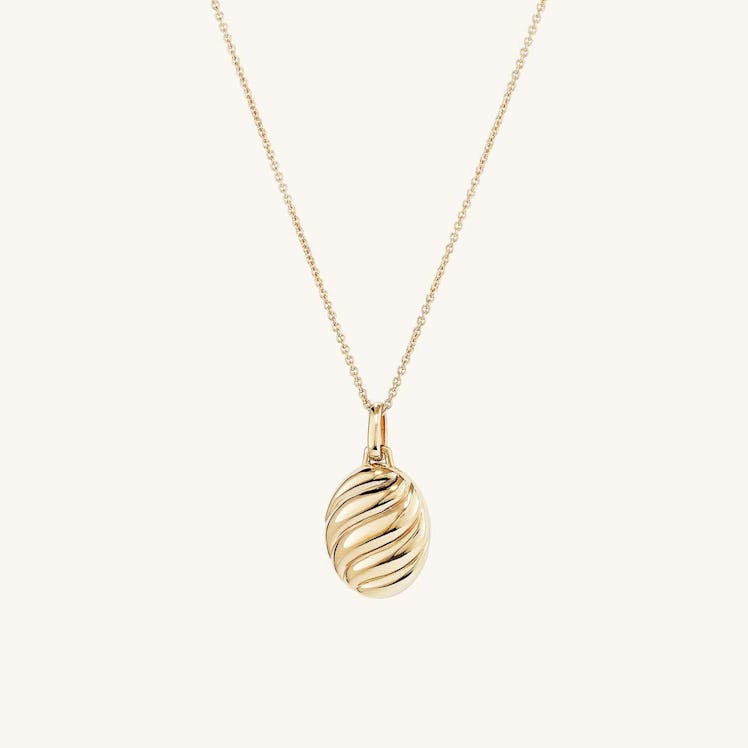 Gold croissant oval locket necklace by Mejuri