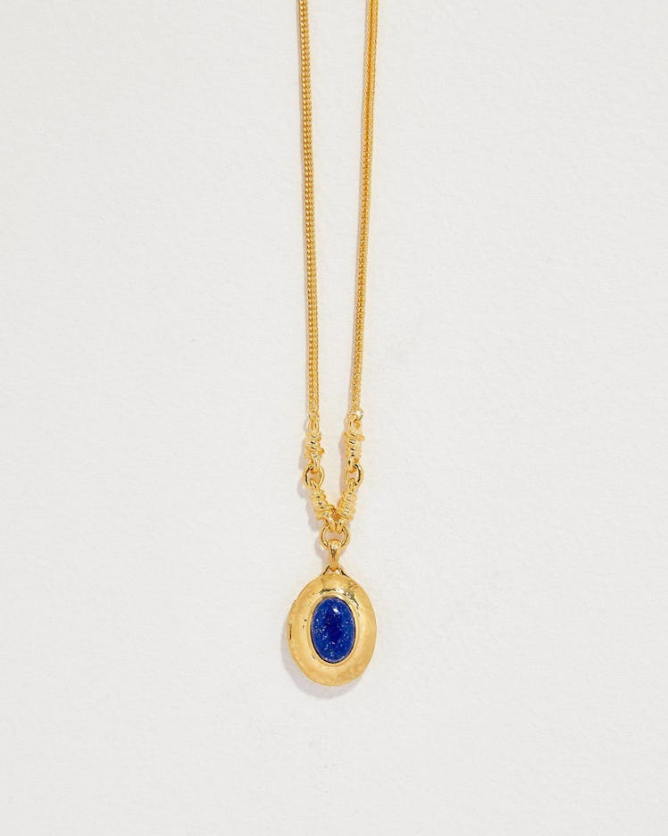 Yellow gold and lapis oval locket by Pamela Love