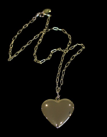 A gold heart locket by Lace by Tanaya
