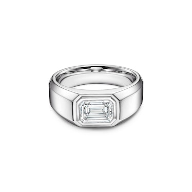 A platinum men's engagement ring with an emerald-cut diamond by Tiffany & Co.