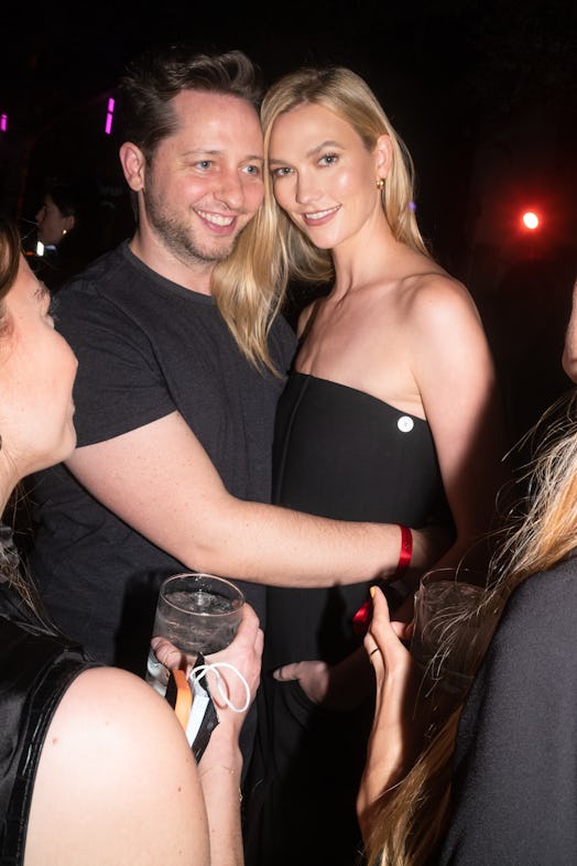 Derek Blasberg and Karlie Kloss hugging for a photo at the ICA VIP cocktail reception