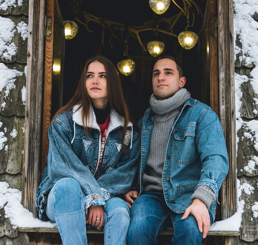 Young couple in a winter cabin on January 8, 2022, the most romantic day of the month for their zodi...