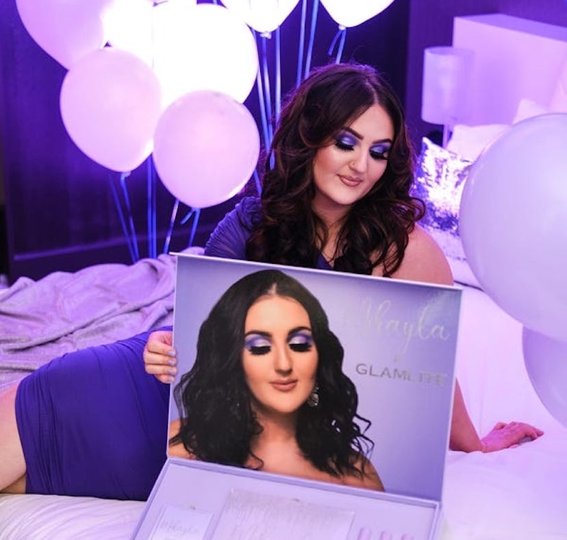 Mikayla Nogueira posing with her first ever makeup collection designed with Glamlite.