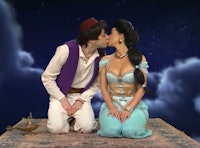 Kim Kardashian and Pete Davidson kiss during a sketch on Saturday Night Live.