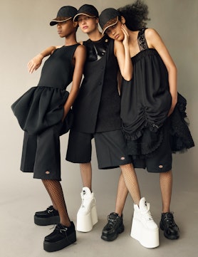 From left: Victoria Fawole wears a Max Mara dress; Dickies shorts; Chanel fishnets; T.U.K. Shoes pla...