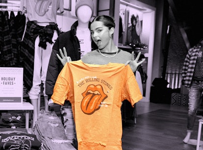 Addison Rae holding a Rolling Stones T-shirt as part of her go-to Christmas 2021 outfit from America...