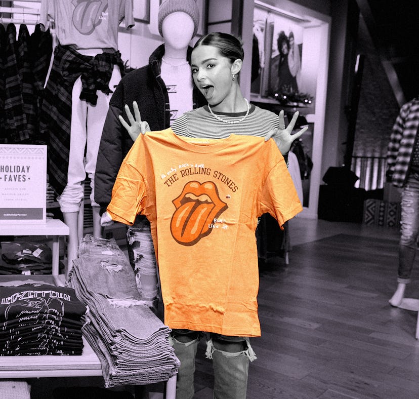 Addison Rae holding a Rolling Stones T-shirt as part of her go-to Christmas 2021 outfit from America...