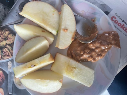 Sliced apples with chunky peanut butter.