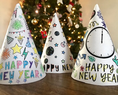 Three kids New Year's Eve party hats