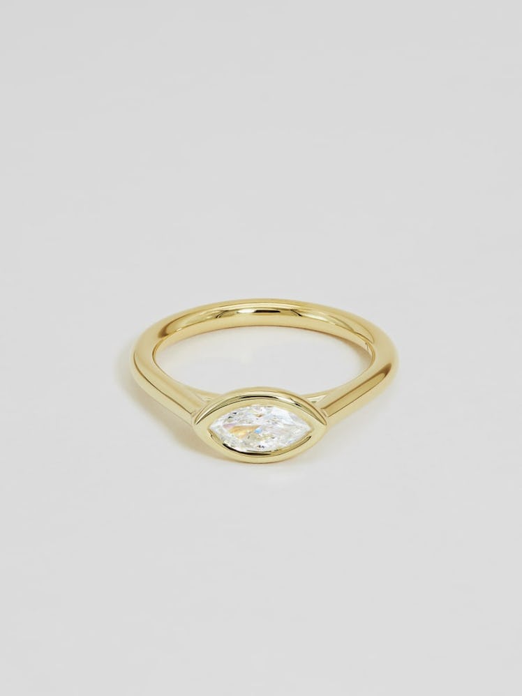 An east west set marquise diamond ring in a vintage bezel setting by Ceremony