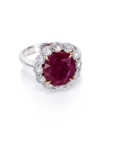 A ruby and diamond cluster ring by Lauren Addison