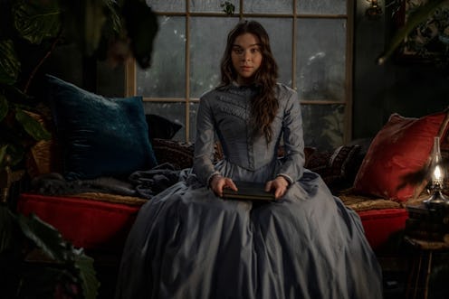 Hailee Steinfeld as Emily Dickinson in “Dickinson” Season 3. Steinfeld wears a dusty blue dress and ...