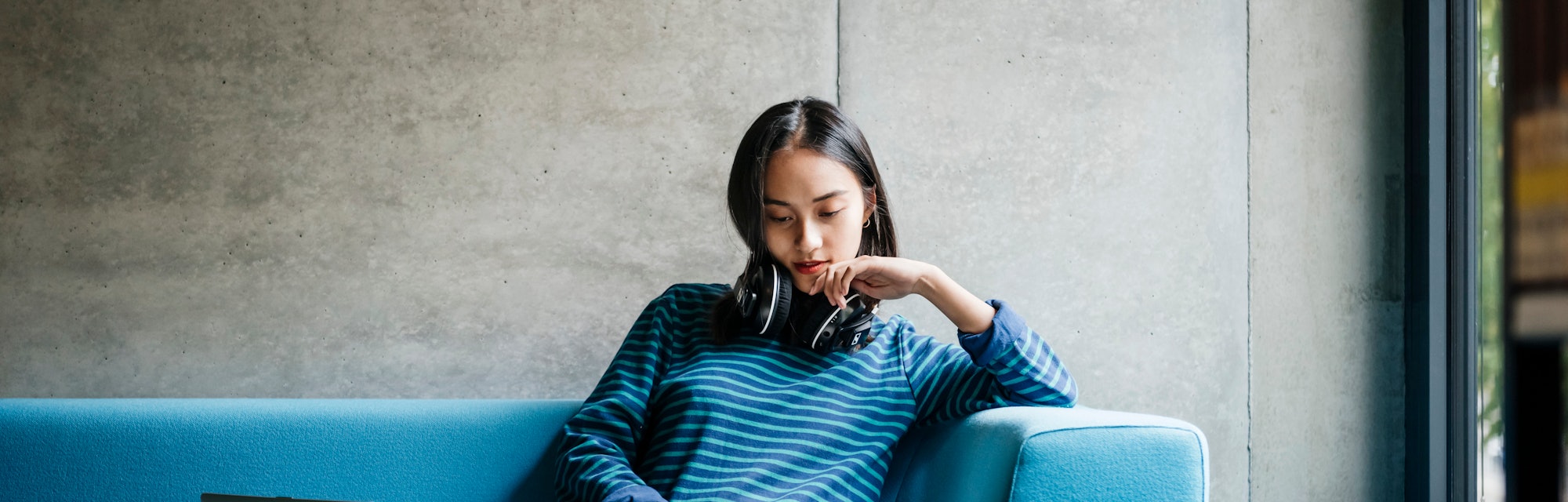 woman reading a book at the library 