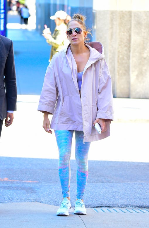 Jennifer Lopez wears a pink jacket.