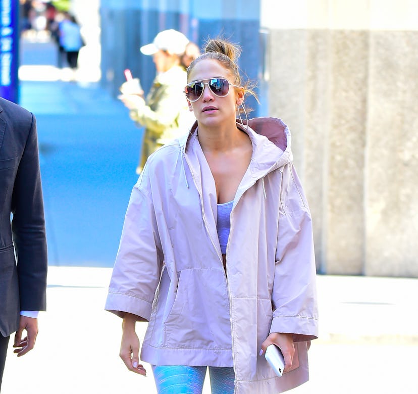 Jennifer Lopez wears a pink jacket.