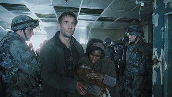 Clive Owen as Theo and Clare-Hope Ashitey as Kee in Children of Men