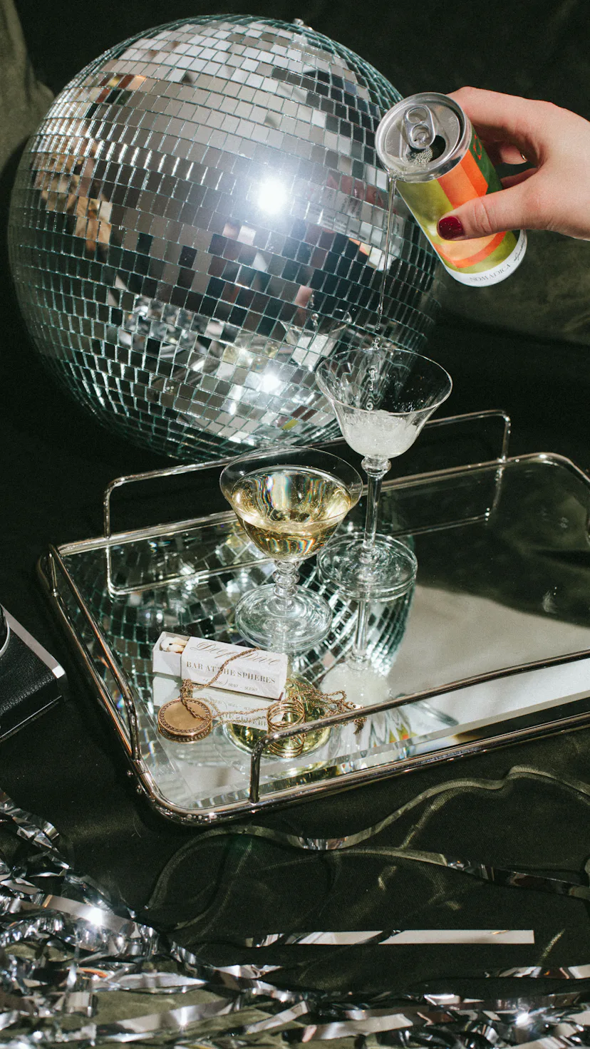 Bubbly drink being poured in a cocktail glass