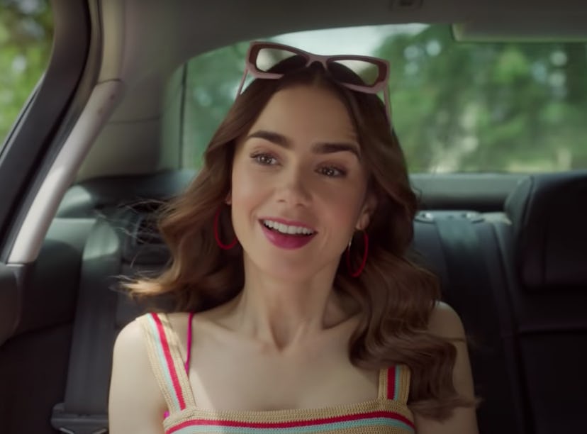 Emily from 'Emily in Paris' sits in a car for Season 2, which has a Duolingo promotion this season.