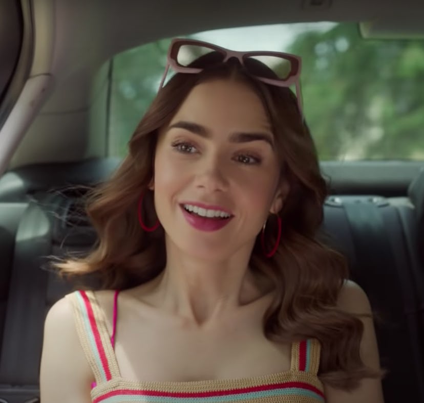 Emily from 'Emily in Paris' sits in a car for Season 2, which has a Duolingo promotion this season.