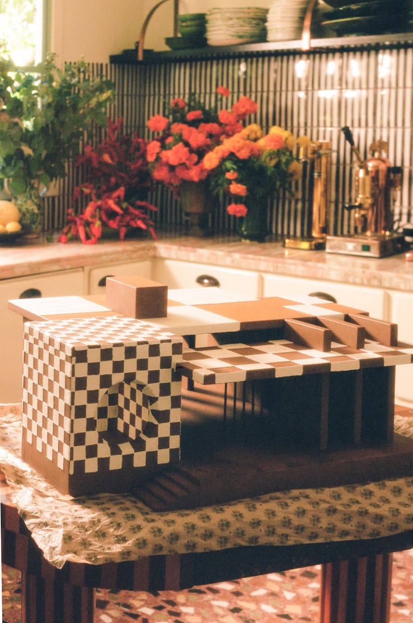 A closeup of the Kelly Wearstler x Flamingo Estate Gingerbread Dream House on a table