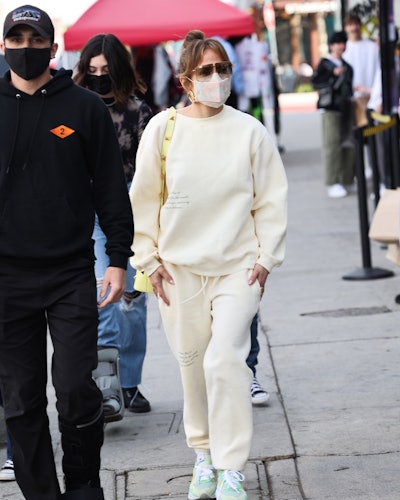 Jennifer Lopez wears yellow White Fox sweatsuit, 2021.