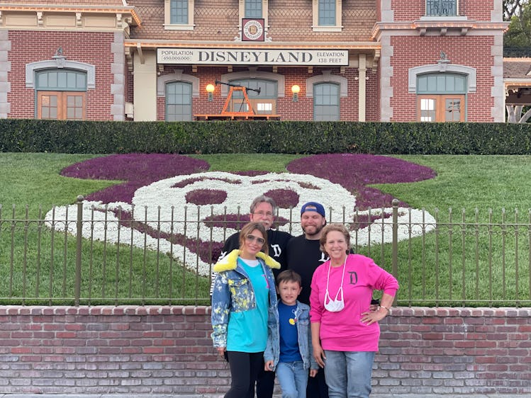 Justin with his mom, his stepson, his wife, Sasha, and his dad, Daniel at Disneyland