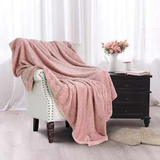 These soft and warm blankets feature a textured fleece material that's great for cozying up on the c...