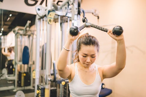 How to do a tricep pull down, according to fitness pros.