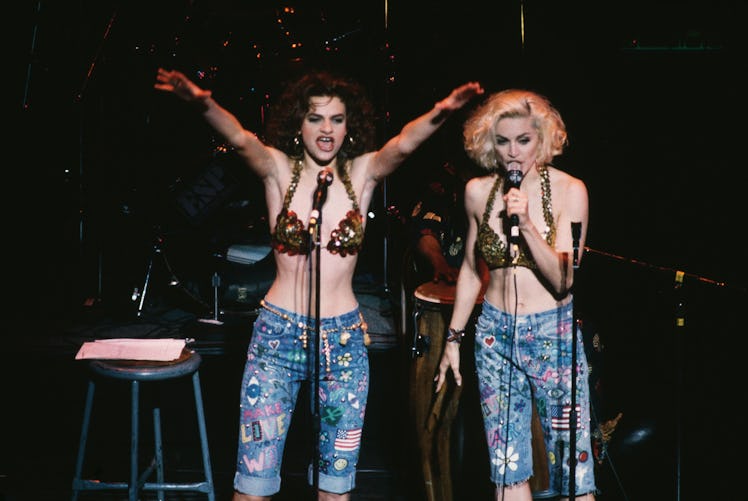 Madonna and actress Sandra Bernhard (left) perform at the Don't Bungle the Jungle benefit concert 