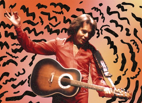 A young Neil Diamond in an orange shirt holding a guitar with an abstract orange and black backgroun...