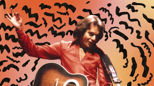 A young Neil Diamond in an orange shirt holding a guitar with an abstract orange and black backgroun...