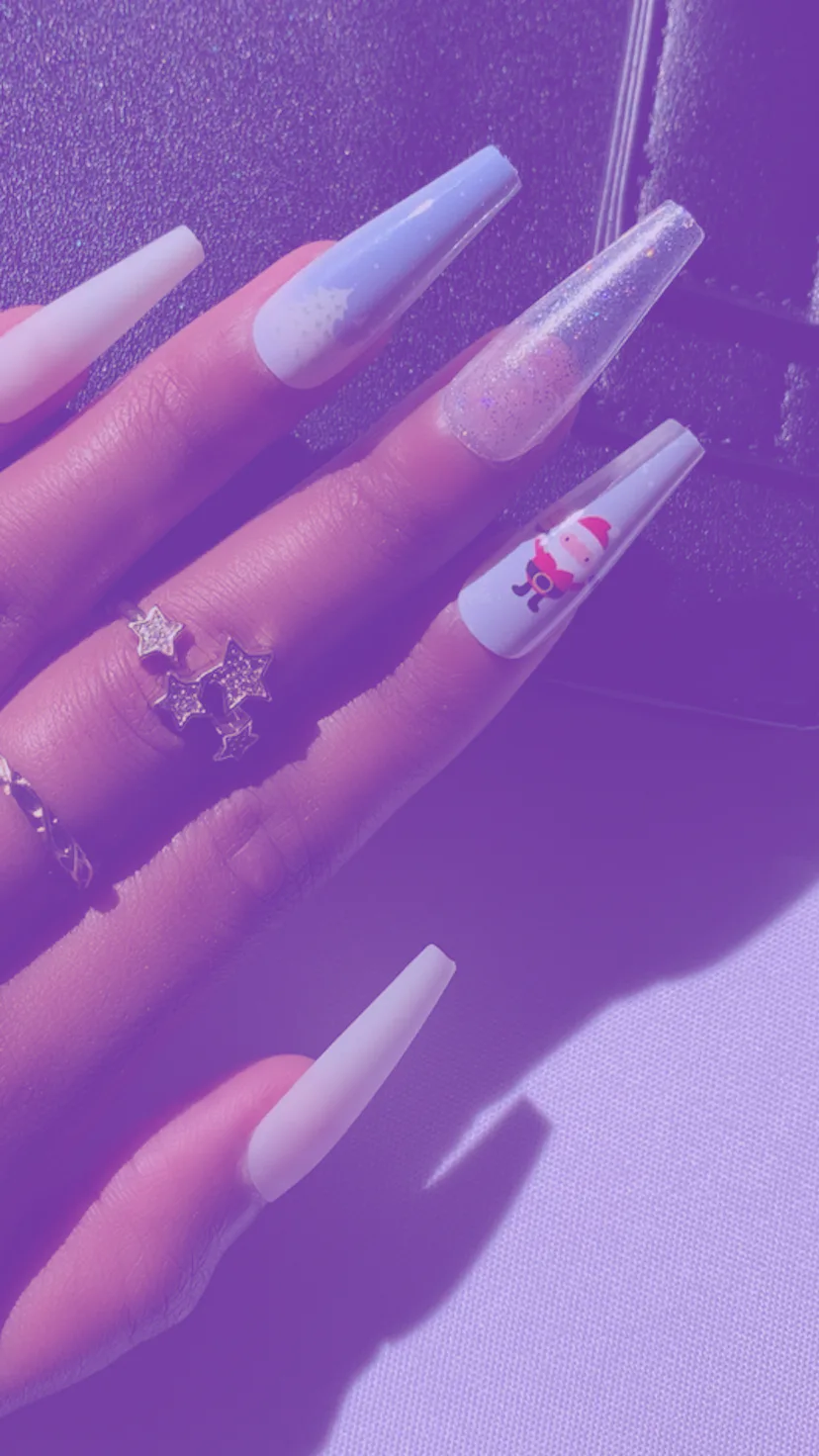 Long press-on nails and sets with a winter deseign, baby blue with some glitter and Santa