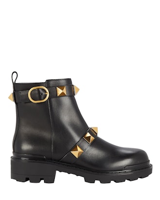 Black combat boots with gold studs by Valentino Garavani