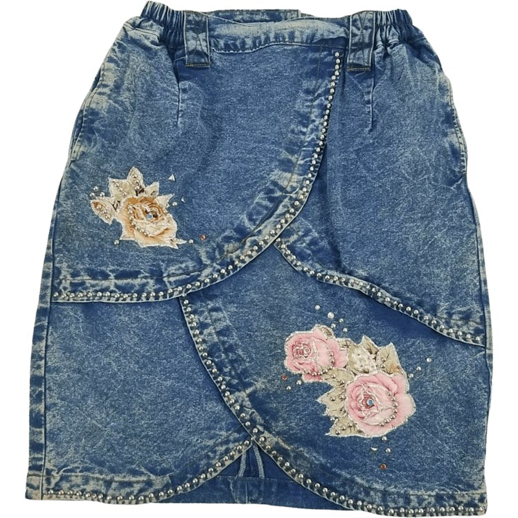 Vintage denim skirt with studded embroidery.