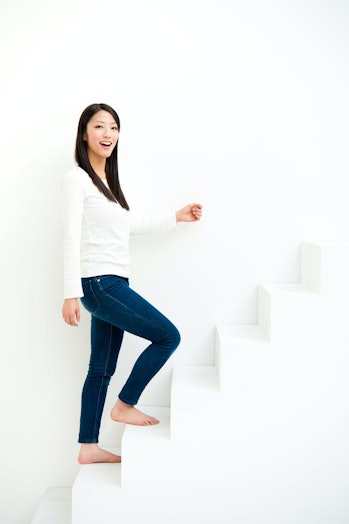 woman walking up stairs