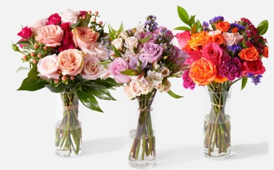 Three bouquets of flowers in glass vases