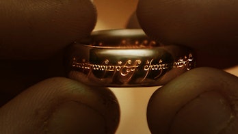 Frodo holding the One Ring in Lord of the Rings: The Fellowship of the Ring.