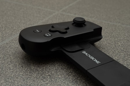 A close up photo of the adapter slipped into the Backbone controller.