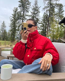 hailey bieber in a red puffer jacket