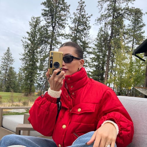 hailey bieber in a red puffer jacket