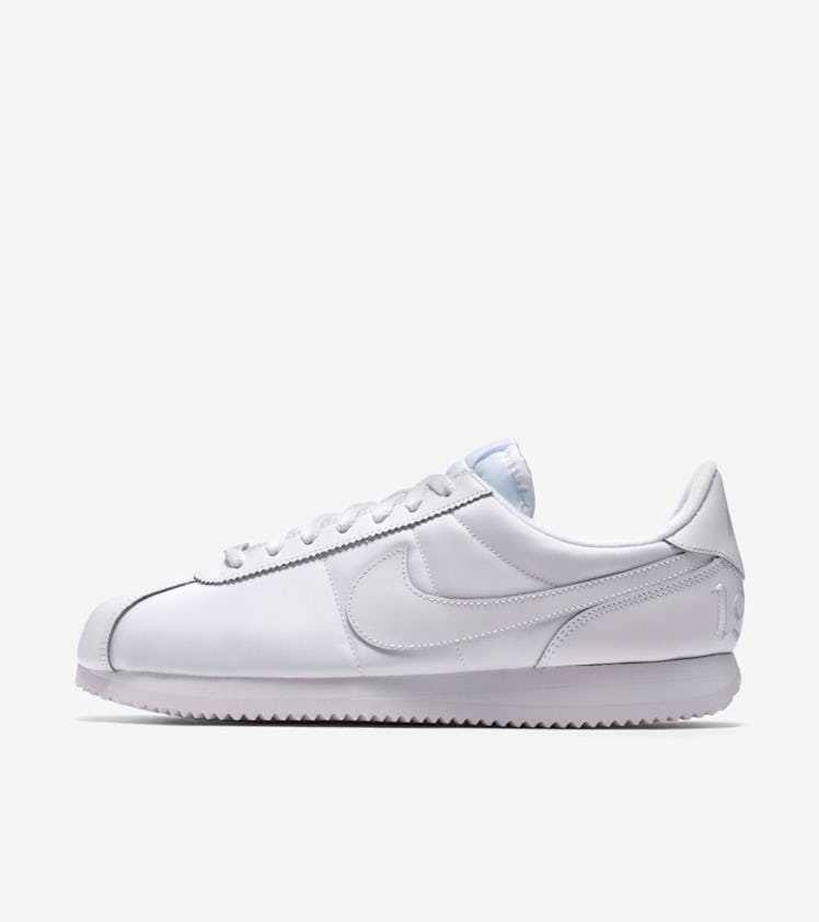 Nike Cortez all white sneakers.